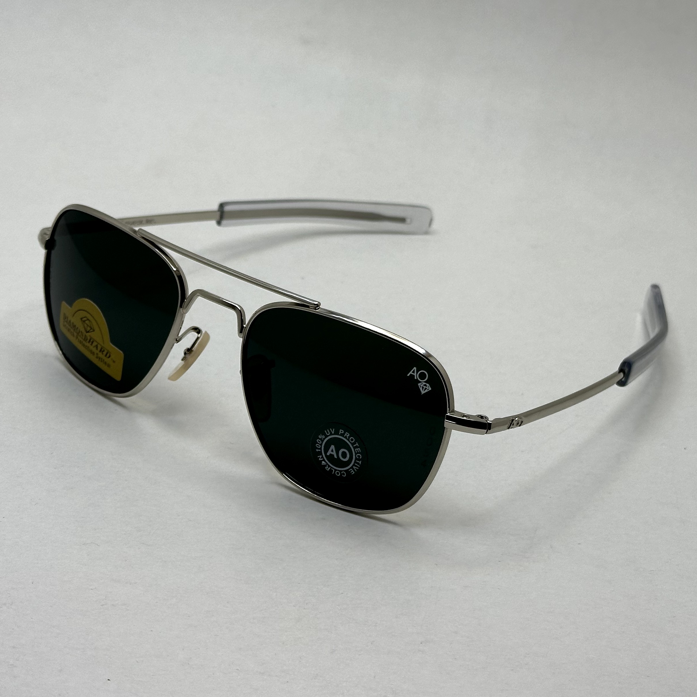 عینک آفتابی شیشه سنگ آمریکن اوپتیکال فریم نقره ای عدسی مشکی سایز 54 آنتی رفلکس با پک کامل و آچار مخصوص عینک