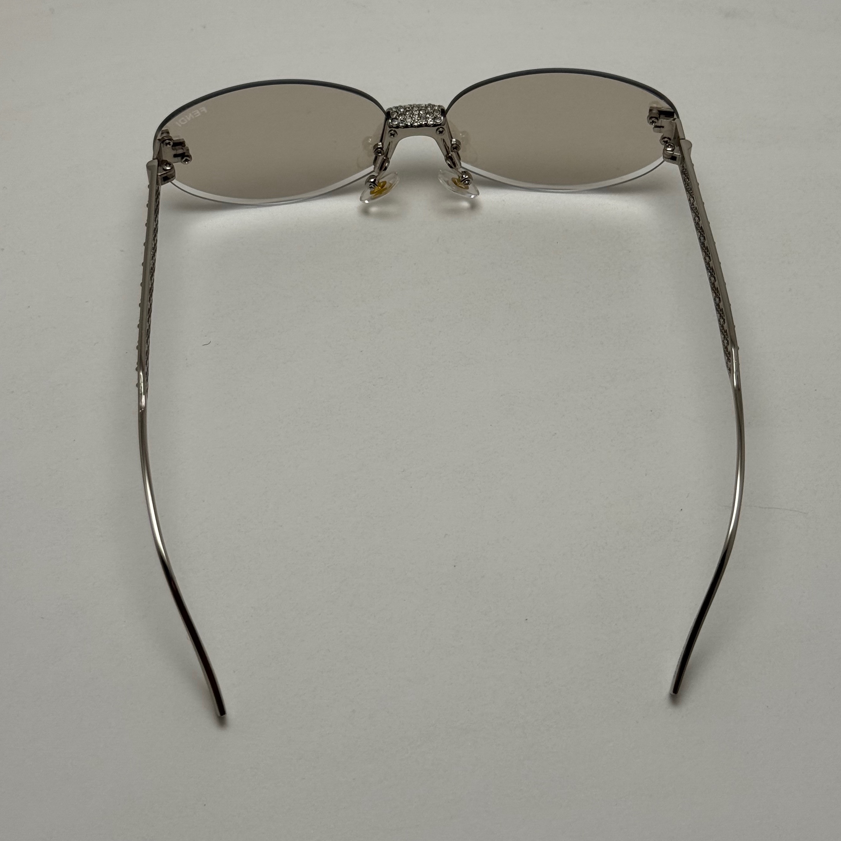عینک آفتابی و شب زنانه فندی Fendi فریم لس بیضی مدل Oval Frame Diamond Style نگیم کاری شده کیفیت مستر شامپاینی شفاف